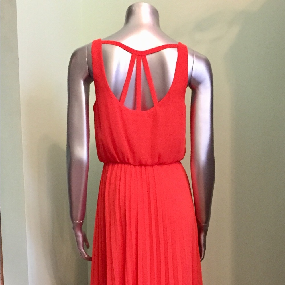 Full length coral dress with pleated skirt